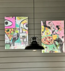 Obraz z motywem pizzy na ścianie w restauracji PIU di Pizza na Kościuszki w Zakopanem